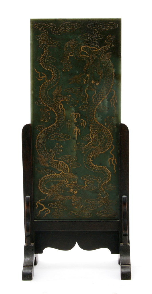 A rectangular plaque of green spinach jade carved with two dragons on either side of a flaming pearl realized $20,740 in Hindman's October 2009 sale. Courtesy Leslie Hindman Auctioneers